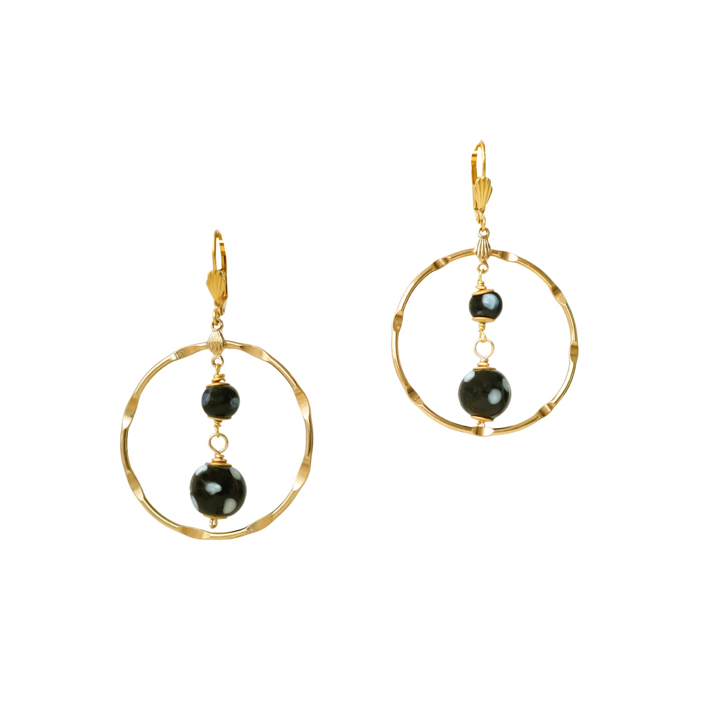 Gold hoop earrings with black beads on a white background