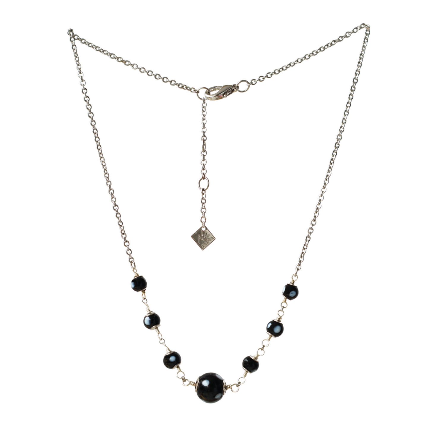 Necklace with black beads on a white background