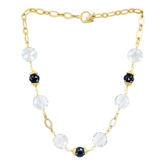 A gold-plated chain necklace featuring clear crystals and black beads, with a vintage appeal.