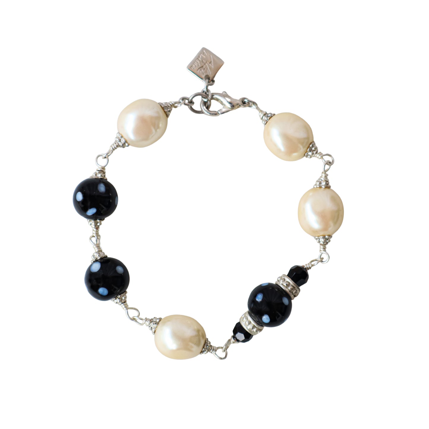 Bracelet with pearls and onyx beads on a white background
