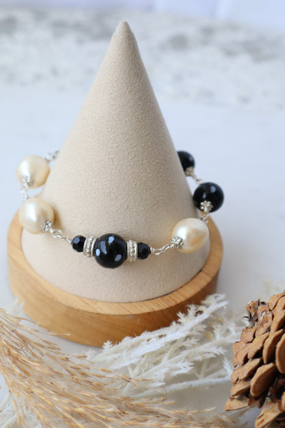 Beaded earring on a wooden cone with a natural background