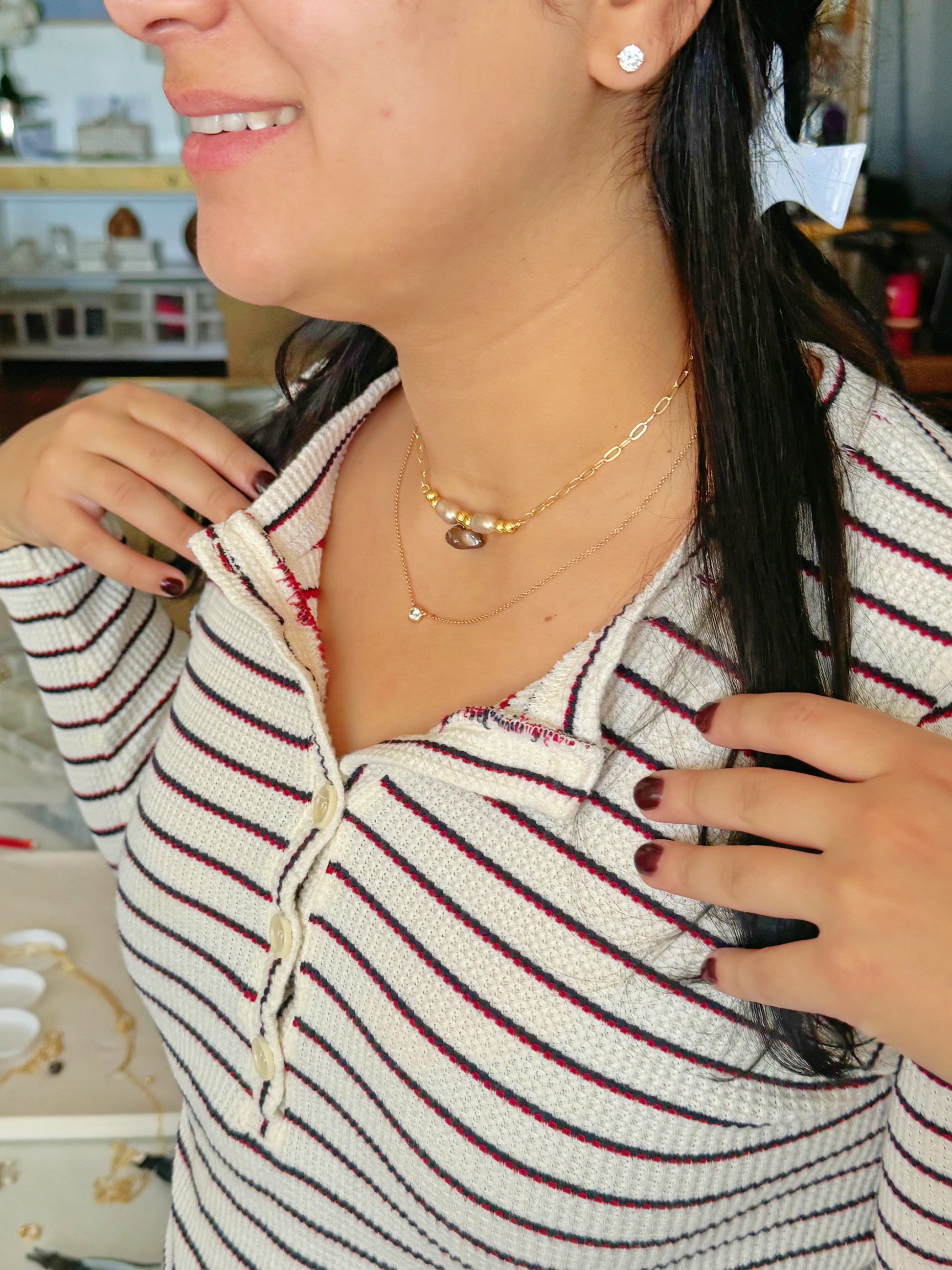 Smiling girl wearing her self-made beaded necklace
