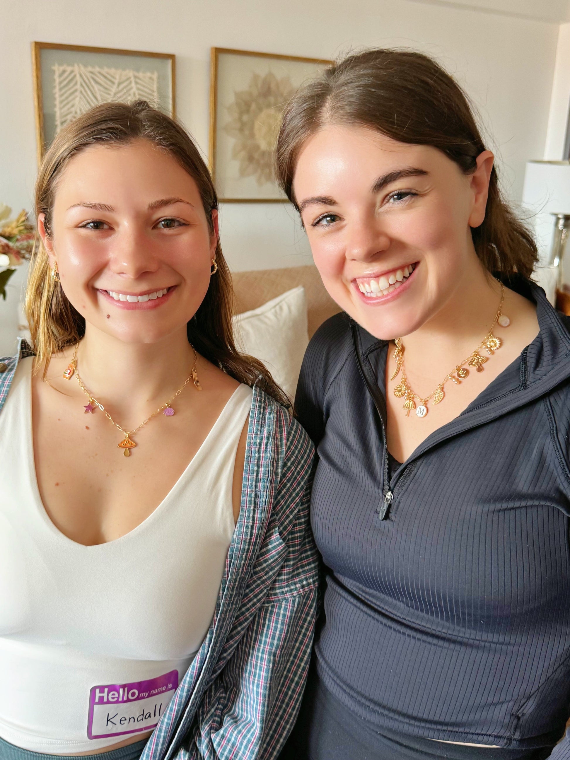 Two girls smiling after finishing a friendship bracelet class
