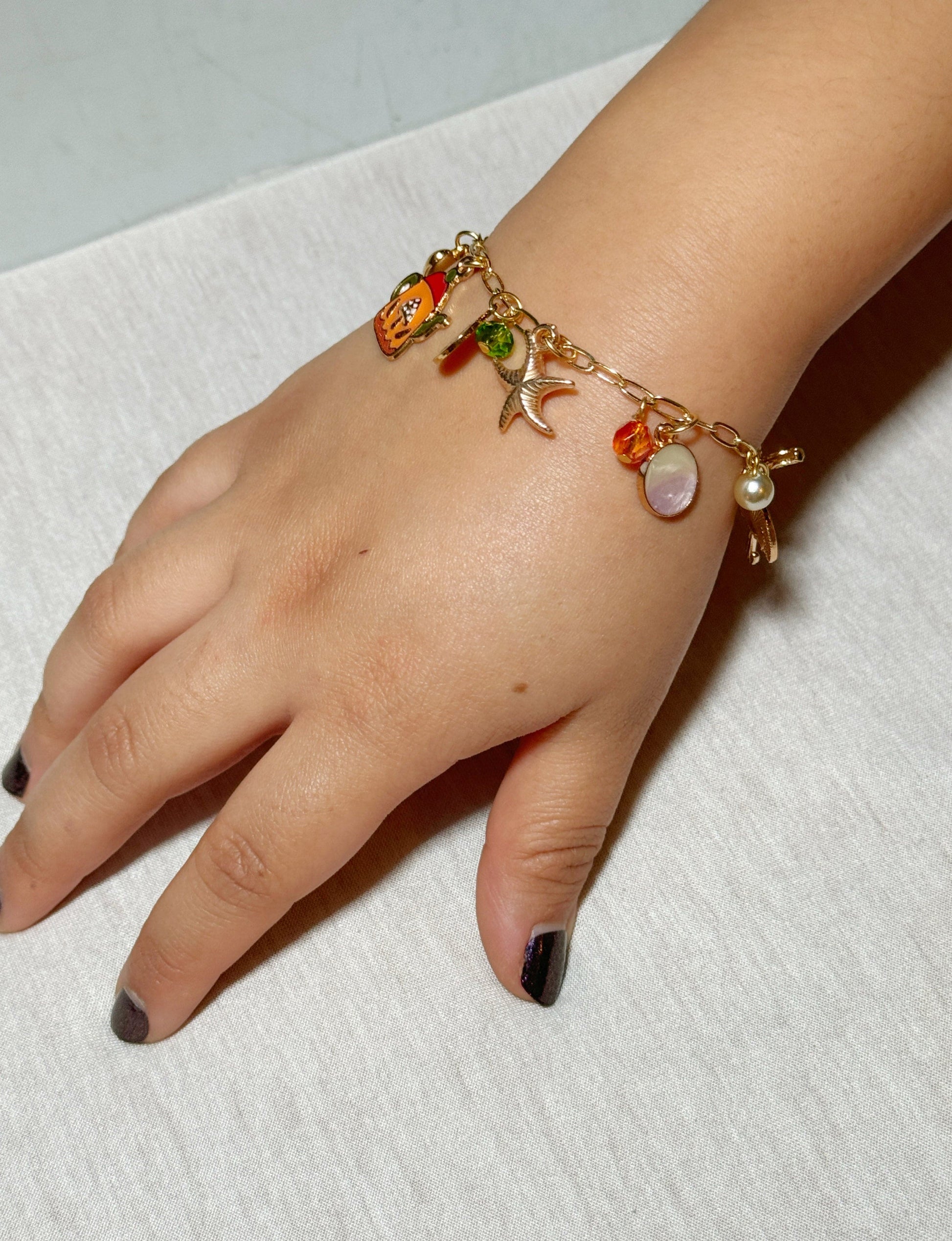 A handmade pearl and gold jewelry set including necklace, bracelet, and earrings, created in a NYC DIY jewelry making class