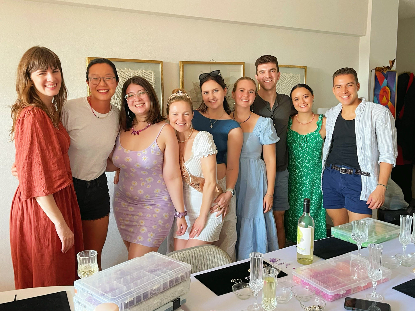 A group of girls smiling after completing a jewelry-making class