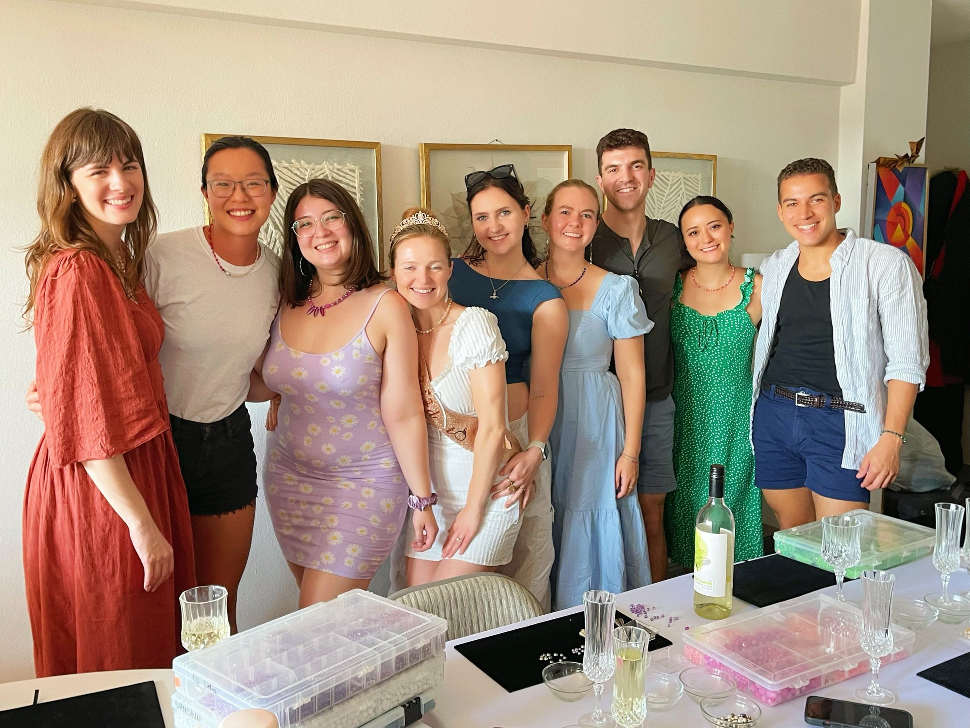 A group of girls smiling after completing a jewelry-making class