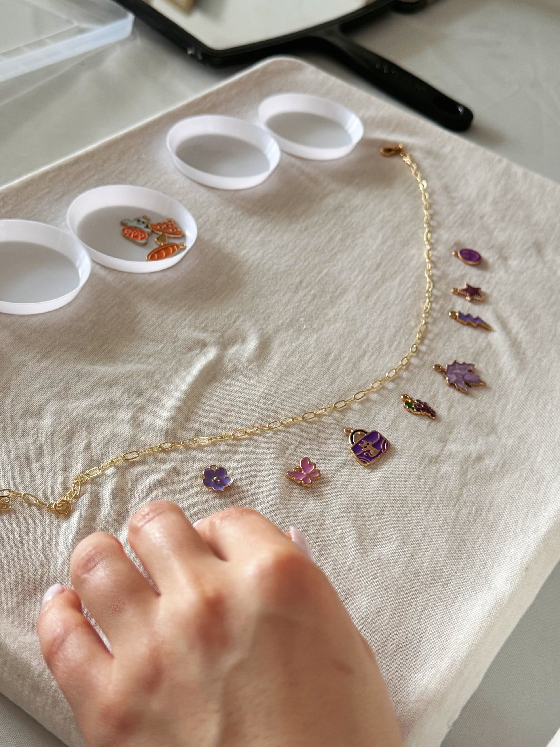 Close-up of beads laid out for necklace crafting
