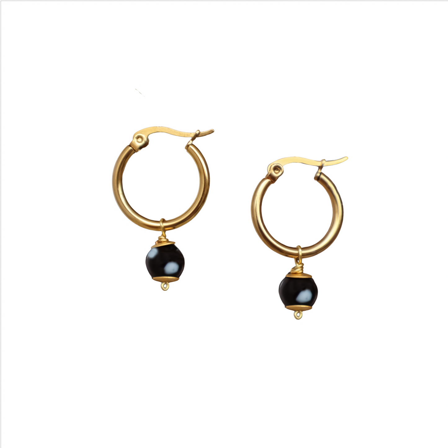 Gold hoop earrings with black beads on a white background. evil eyes, handmade jewelry. New York. Unique jewelry
