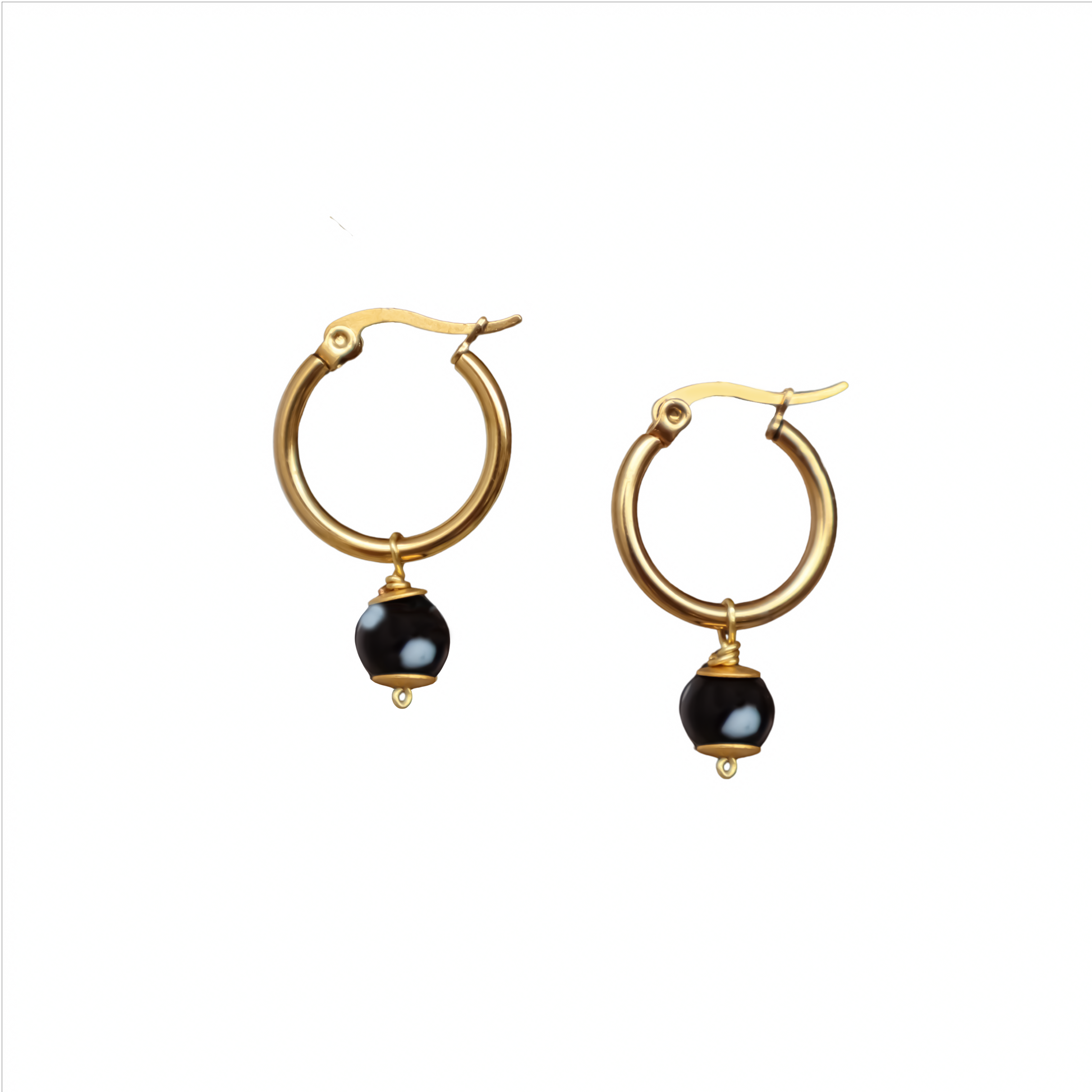 Gold hoop earrings with black beads on a white background. evil eyes, handmade jewelry. New York. Unique jewelry