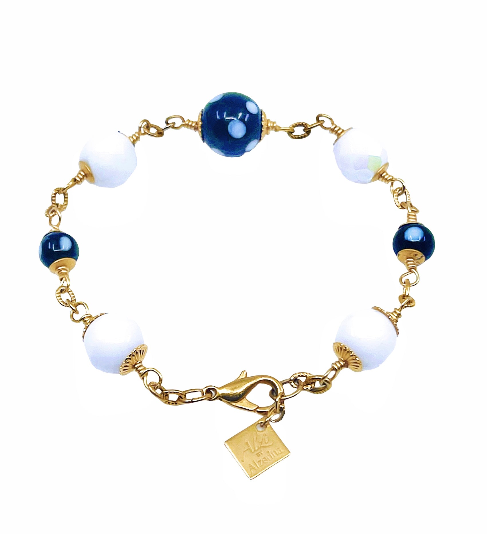 Features black and white evil eye beads (Conta Di Ojo) for protection and positivity