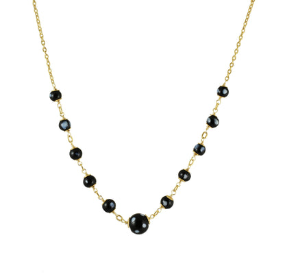 Maezinha gold-plated necklace with Conta Di Ojo evil eye beads, front view on grey background