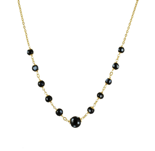Maezinha gold-plated necklace with Conta Di Ojo evil eye beads, front view on grey background
